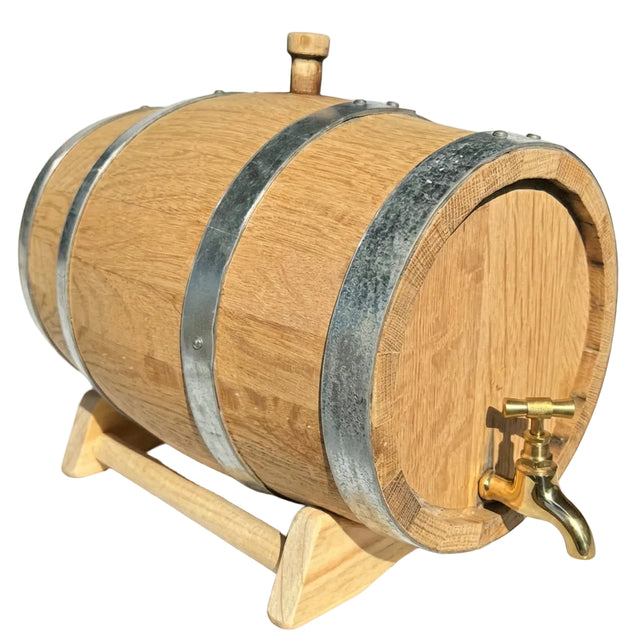 Wooden barrel with a gold faucet on a white background