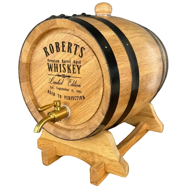 Wooden whiskey barrel with 'Roberts Whiskey' branding on a black background
